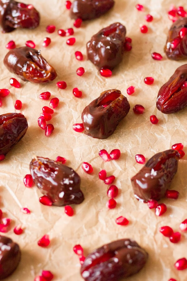 Chocolate dipped dates with pomegranate arils.