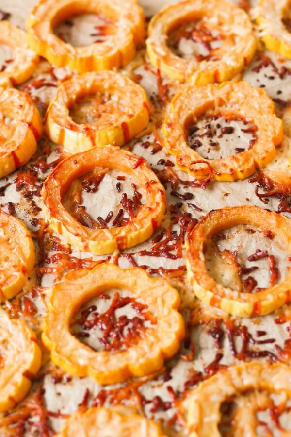 Roasted Delicata squash rounds with crispy parmesan.