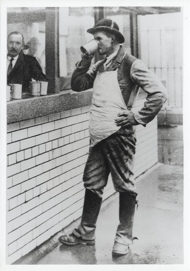 A Guinness drayman 'at tap' - or collecting his daily beer allowance - around 1910. Photo: Guinness Archives