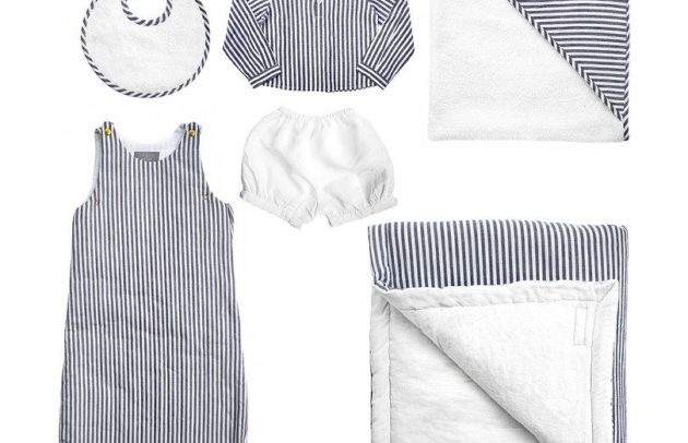 a black-and-white striped layette set including bib, shirt, shorts and more