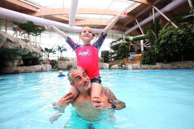 Baz Ashmawy and his daughter Mahy, 6, make a splash at the official launch of Center Parcs Longford Forest. Photo: Leon Farrell/Photocall Irelnd