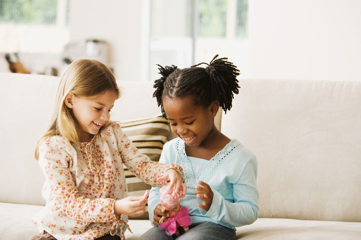 Girls playing with doll