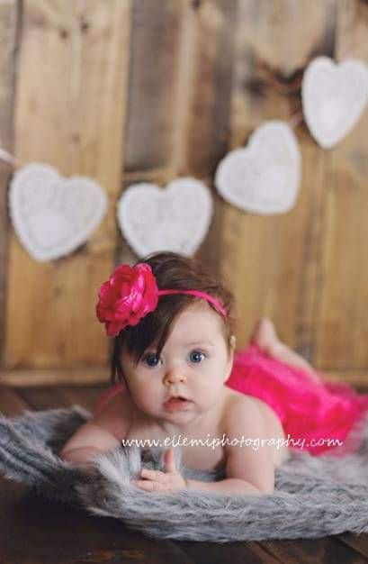 baby dressed in pink for Baby's First Valentine's Day Photo shoot