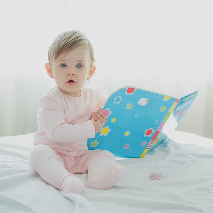 baby holding book