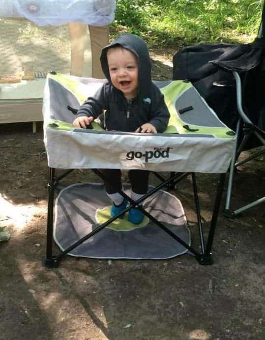 baby in portable activity center