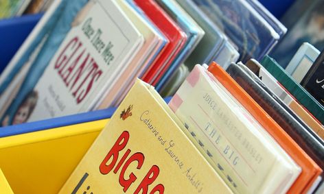 Stack of books for Outschool class featuring LGBTQ+ stories