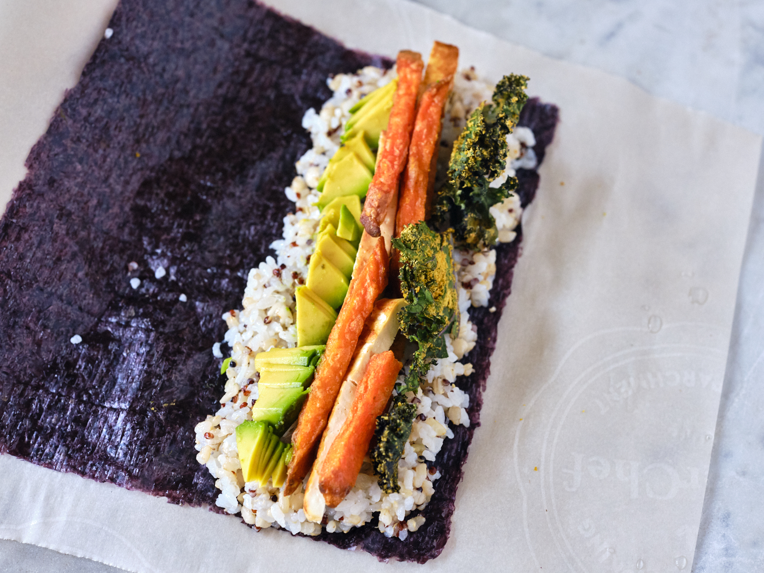 Preparing Vegan Sushi on Sheet of Nori